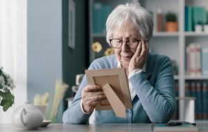 Older woman looking at a photograph