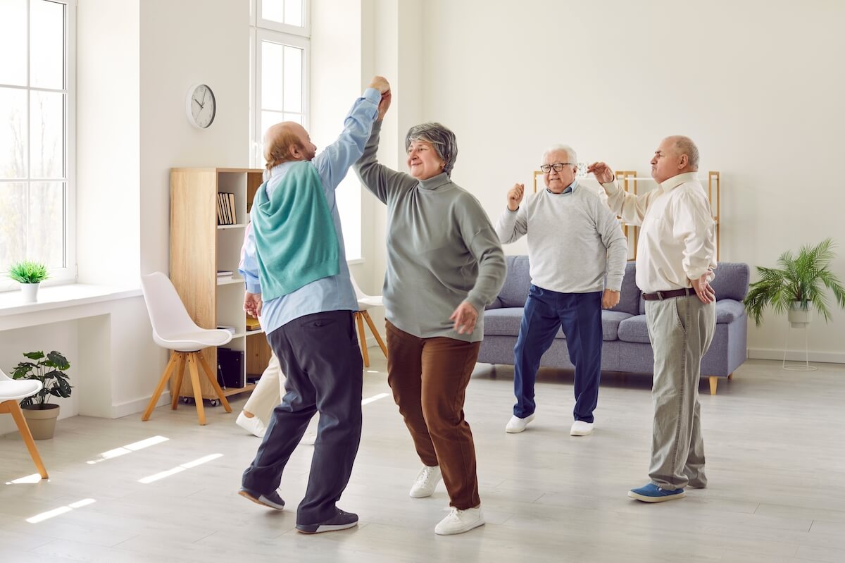 Group of senior friends dancing together