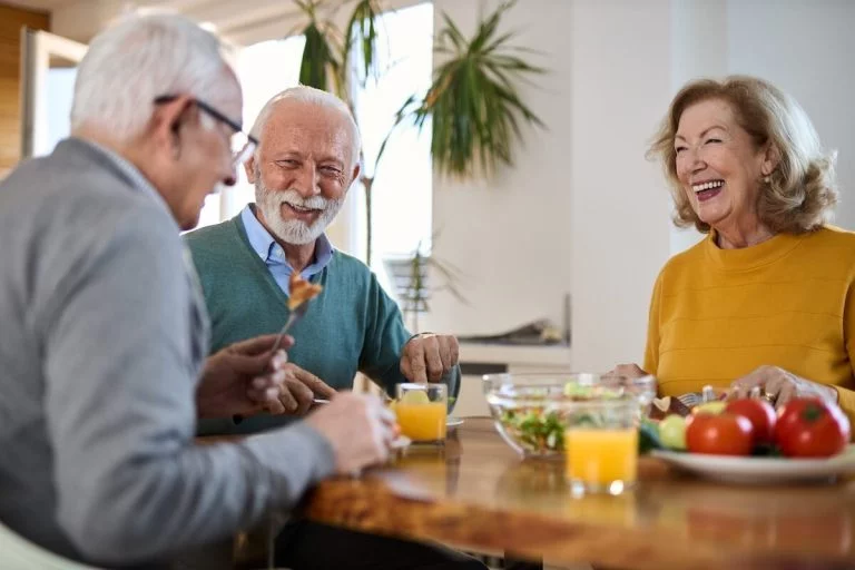 Older adults having breakfast together.