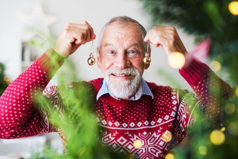 Older man with Christmas decorations